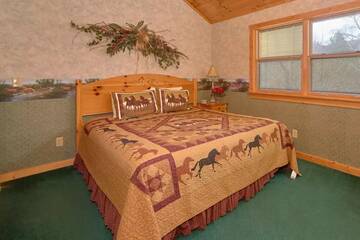 King bed in your cabin's fourth bedroom.